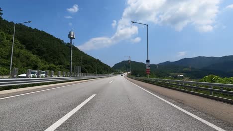Driving-Through-Country-Asphalt-Road-Near-Seoraksan-National-Park-In-Sokcho,-South-Korea