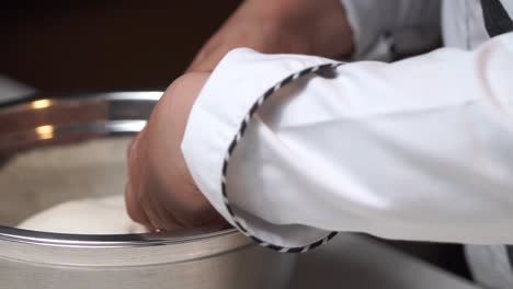kneading-white-dough-with-hands-placing-for-resting-formenting