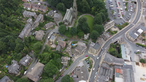 Aerial-Drone-Yorkshire-Town-in-the-day-with-Traffic,-Trees,-Buildings-and-a-Church,-Todmorden,-UK