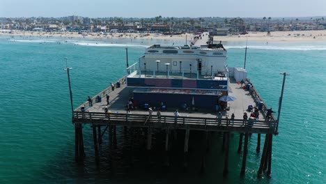 Aerial-view-of-fisherman-at-the-end-of-Newport-Pier,-Newport-Beach,-California