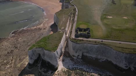 Kingsgate-bay-white-chalk-cliff-coastal-formation-English-Kent-seaside-Aerial-reverse-tilt-up-reveal-view
