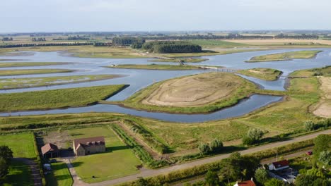 Aerial-high-altitude-approach-to-the-Waterdunes---a-nature-area-and-recreational-park-in-the-province-of-Zeeland,-The-Netherlands