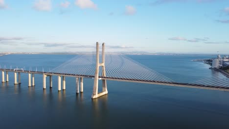 AERIAL-Side-Panning-Shot-of-Vasco-da-Gama-Bridge-in-Lisbon,-Portugal