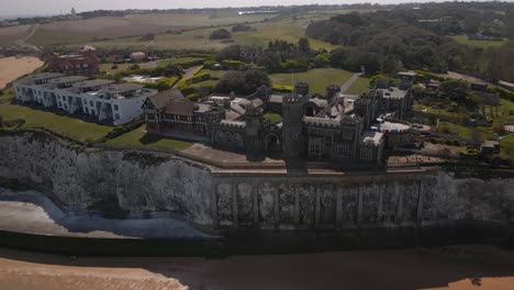 Kingsgate-castle-Kent-seaside-English-chalk-cliff-coastal-bay-landmark-Aerial-view-high-angle-dolly-left
