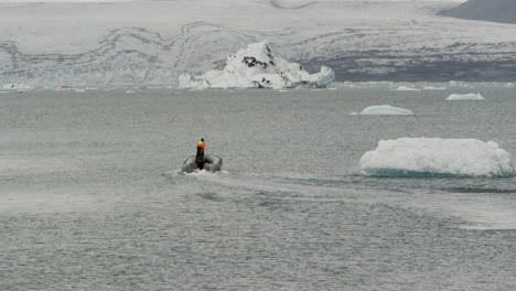 A-small-RIB-is-used-to-survey-the-melting-glacial-ice-fields-of-Jokulsarlon-Iceland,