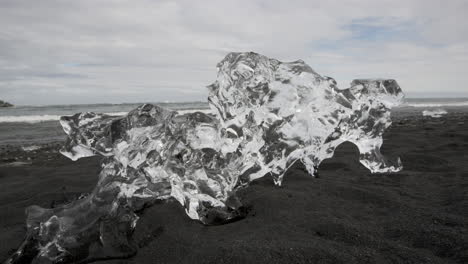 Diamond-beach-Iceland---A-large-natural-ice-sculpture-sits-on-the-black-volcanic-beach-and-glistens-like-a-diamond