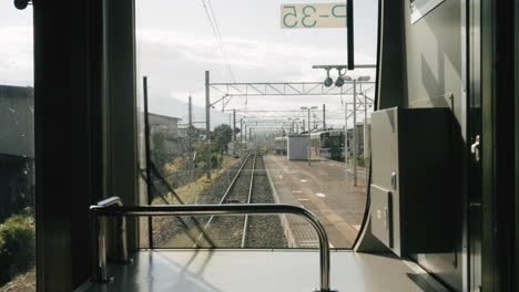 View-From-The-Glass-Window-Of-Traveling-Train-On-Railroad-At-Sunny-Day-In-Sendai,-Japan