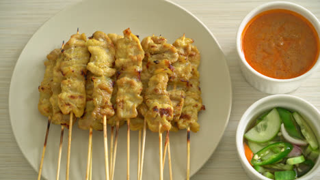 Pork-satay-with-peanut-sauce-pickles-which-are-cucumber-slices-and-onions-in-vinegar---Asian-food-style
