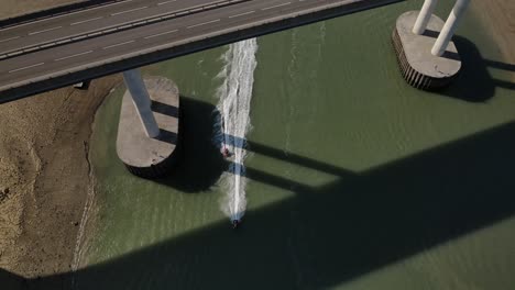Top-View-Of-A-Couple-Of-Jetski-Under-The-Kinsgferry-Bridge-And-Sheppey-Crossing-In-Southeast-England
