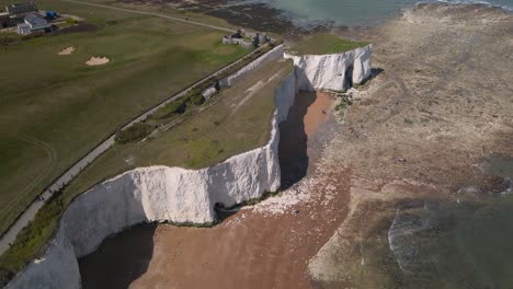 Kingsgate-bay-chalk-cliff-coastal-formation-English-Kent-seaside-Aerial-birdseye-view-drone-flying-over