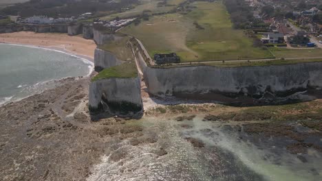 Kingsgate-bay-white-chalk-cliff-coastal-formation-English-Kent-seaside-Aerial-dolly-right-view-high-angle