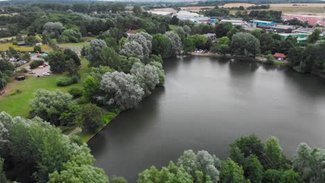 Drone-fly-around-Needham-market-lake-with-beautiful-view-of-the-little-traditional-English-village-during-a-sunny-day-of-summer