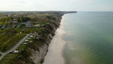 Stunning-drone-footage,-beautiful-views-along-the-coast-of-Chiapowo-Poland-on-a-clear-and-calm-day