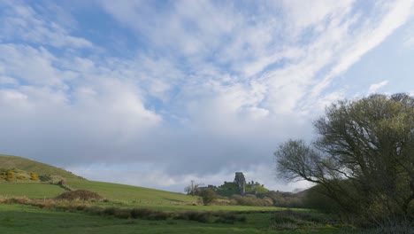 Scenic-panning-shot-of-Corfe-Castle-and-the-surrounding-Dorset-countryside