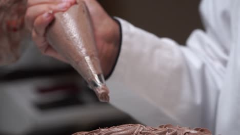 wipping-cream-on-second-layer-of-choccalate-cake-chocalet-design-slow-motion