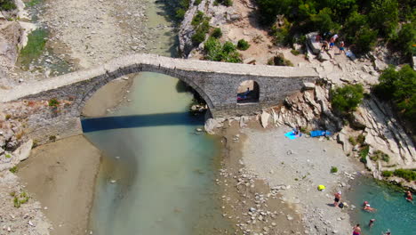 drone-view-of-the-Ottoman-Kadiut-bridge-and-the-Banjat-e-Benjës-hot-springs-,-which-have-become-one-of-the-most-photogenic-places-in-southern-Albania