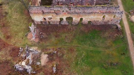 Historical-stone-medieval-castle-in-aerial-drone-low-altitude-view