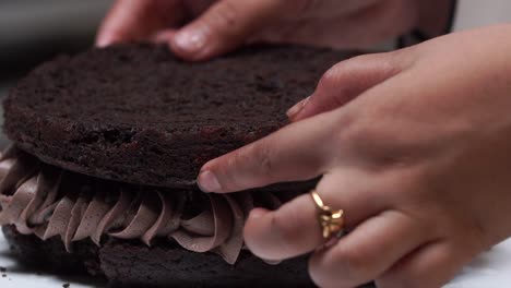putting-second-layer-of-cake-close-up-soft-cake-