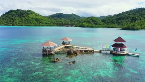 Water-Cottages-Connected-By-Wooden-Bridge-At-The-Tagbak-Marine-Park-In-Southern-Leyte,-Philippines