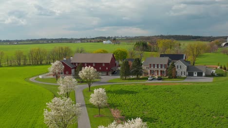 Aerial-reveals-beautiful-farm-with-red-barn