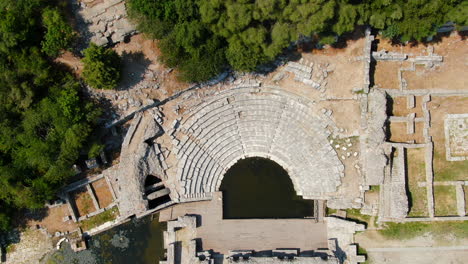 Shot-drone-cenital-Butrint-Roman-amphitheater-and-ruins-in-Albania