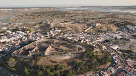 Dolly-in-aerial-view-of-the-remains-of-heritage-castle-and-fortification-in-Castro-Marim,-Algarve,-Portugal