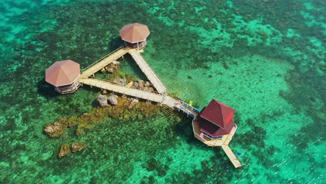 Cottages-Connected-By-Boardwalk-At-Tagbak-Marine-Park-On-A-Sunny-Summer-Day-In-The-Philippines