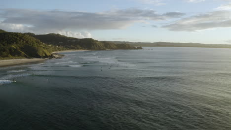 4k-Drone-shot-of-a-surf-break-in-the-sea-water-at-Byron-bay,-Australia