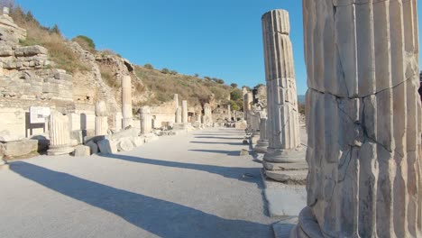 Ruins-of-broken-ancient-marble-pillars-in-Ephesus,-Turkey-moving-shot