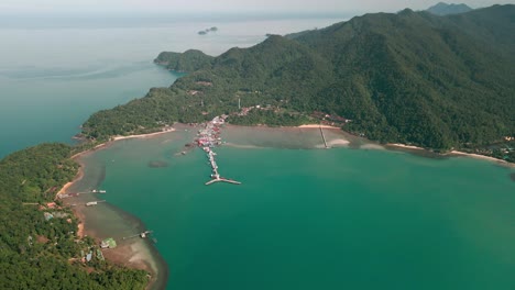 Scenic-Aerial-View-with-Beautiful-Landscape-of-Koh-Chang-Island-at-Bang-Bao-Fishing-Village-with-Pier-Over-Turquoise-Waters