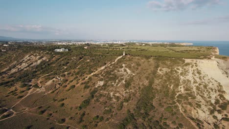 Lagos-Coastline-Reveal-from-Praia-da-Luz-over-Atalaia-Mark,-Algarve