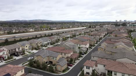 Tustin-new-home-community-in-Los-Angeles-city,-aerial-shot-of-California-suburb