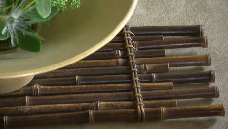 Bamboo-mat-under-an-ikebana-flower-arrangement