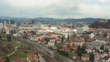 Ljubljana,-Slovenia-capital-city-skyline-on-overcast-day,-4K-aerial-arc-shot