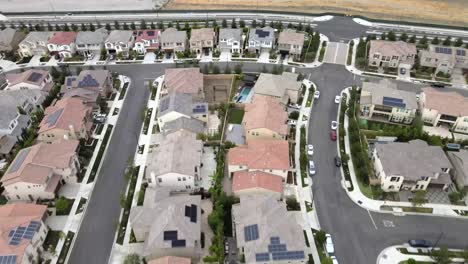 Tustin-home-community,-aerial-of-houses-with-solar-panels,-Los-Angeles-California