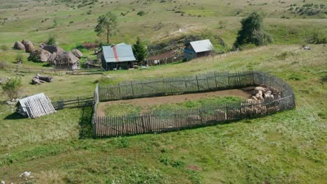 Aerial:-old-wooden-pen-fencing-for-animal-herding,-traditional-farming-technique