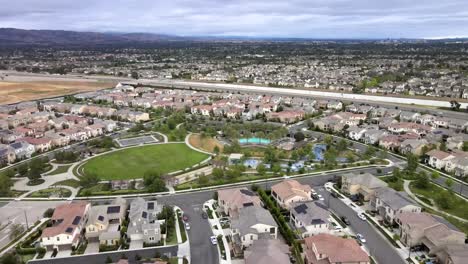 Bird's-eye-view-from-drone-of-Tustin-city-park-and-neighborhoods,-California