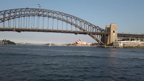 View-Of-Harbour-Bridge-With-Opera-House-In-Background-During-Sunset-In-Sydney,-NSW,-Australia---wide-shot