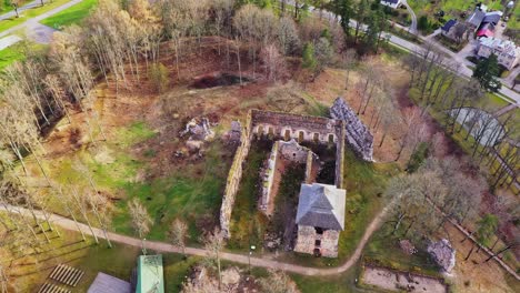 Panoramic-view-of-medieval-castle-with-tower-ruins,-aerial-drone-shot