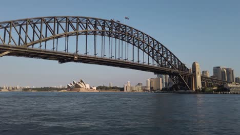 Sydney-Harbour-Bridge-And-Opera-House-At-Sunset-In-Sydney,-Australia---wide-shot