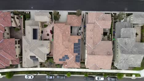 Birdseye-aerial,-solar-panel-on-roof-of-Tustin-home,-house-in-neighborhood