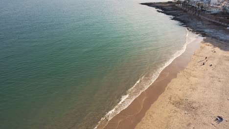 Praia-da-Luz-seafront-with-golden-beach-sand-in-Algarve,-Portugal