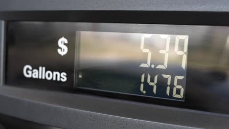 Gas-pump-filling-station-price-ticker-going-over-three-dollars-cost-per-gallon-going-up-as-fuel-is-being-pumped-from-0-to-50-dollars---sped-up-2Xs-speed-in-4K-60fps---shot-on-Sony-A7Siii