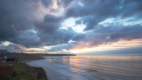 Whitby-coast,-North-Yorkshire,-evening-timelapse-footage,-lovely-clouds-and-colours,-from-pavillion-towards-Sandsend,-north-york-moors