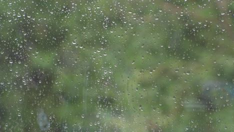 A-close-up-shot-of-a-window-while-it-is-raining