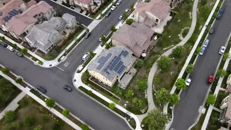 House-in-Tustin-neighborhood,-solar-panels,-energy,-aerial-4K