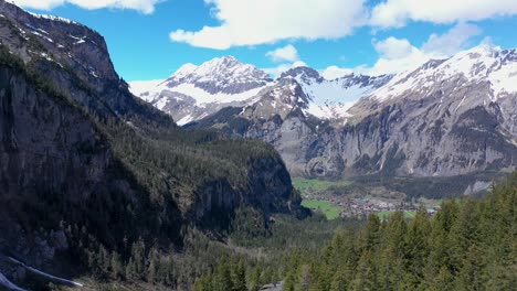 Drone-flight-over-a-beautiful-alpine-glacier-valley-and-vast-mountainous-landscape