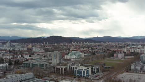 Aerial-shot-slowly-circling-around-the-capital-of-Slovenia,-Ljubljana-on-an-overcast-day