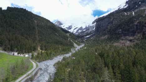 Drone-flight-over-a-beautiful-alpine-glacier-valley-and-vast-mountainous-landscape
