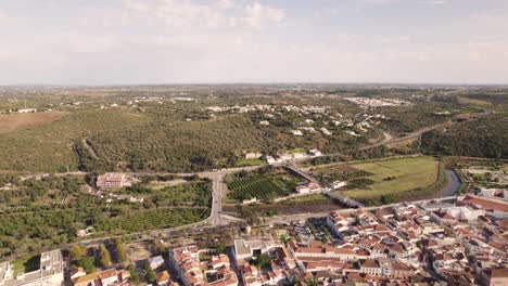 Aerial-wide-fly-over-Algarve-Castle-of-silves-from-Arade-River-outskirts